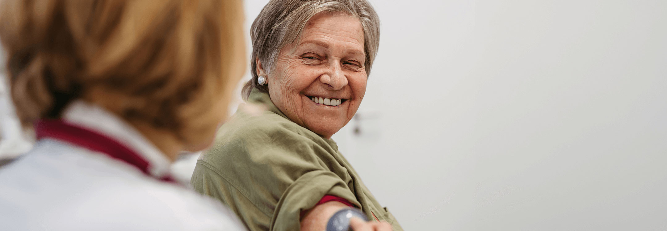 Image of an older woman getting her Blood pressure taken
